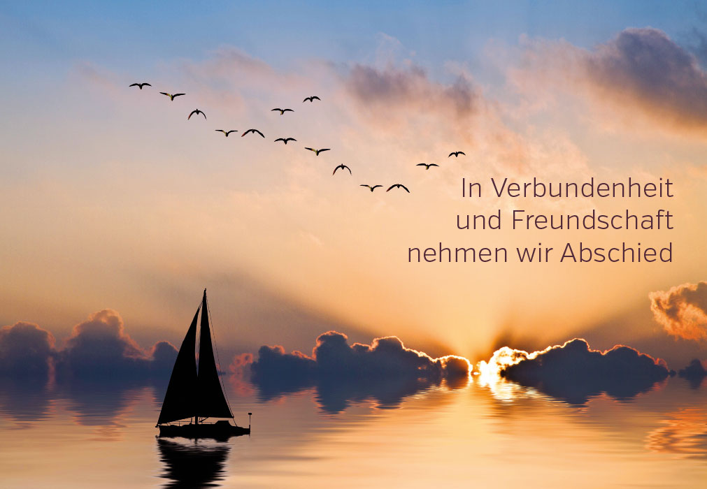 Trauer - Segelboot auf dem Meer im Sonnenuntergang